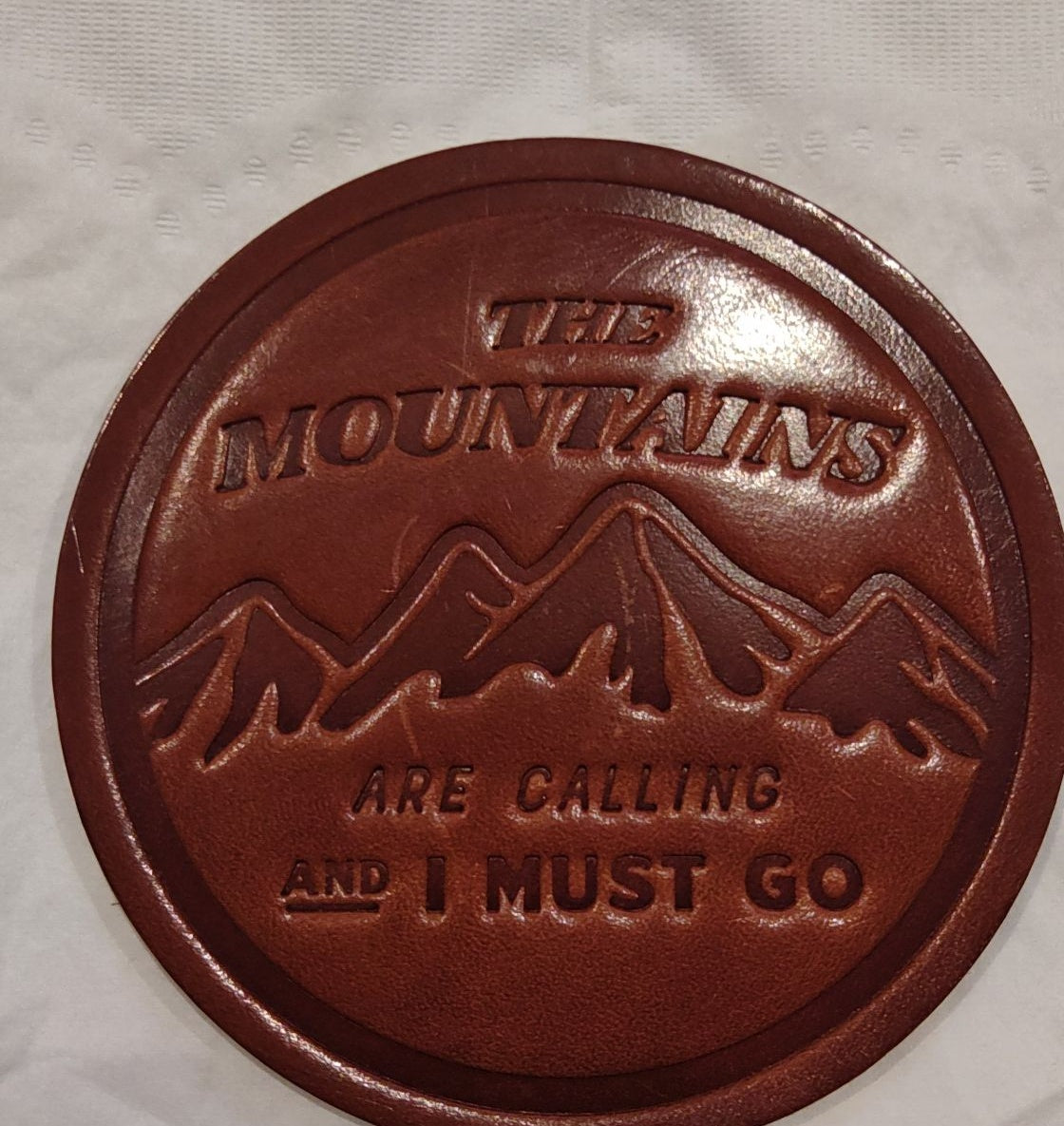Sugarhouse leather coaster, The Mountains Are Calling